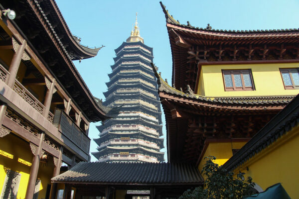 Tianning Temple’s enormous gold-spire-topped pagoda (reconstructed in 2007, and reportedly the tallest in the world), rises high into the sky, dwarfing the temple’s one- and two-story buildings, with their bright yellow walls, dark brown wooden beams, and tiled rooftops.