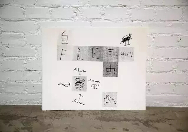 画 艾未未的儿子画给他的画，上面写着“free aiww”。艾未未的妻子和6岁的儿子现在住在德国，他们已经一年没有见面。