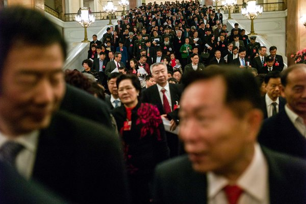 Fred Dufour/Agence France-Presse — Getty Images 三月，在北京参加全国人大会议的人大代表。