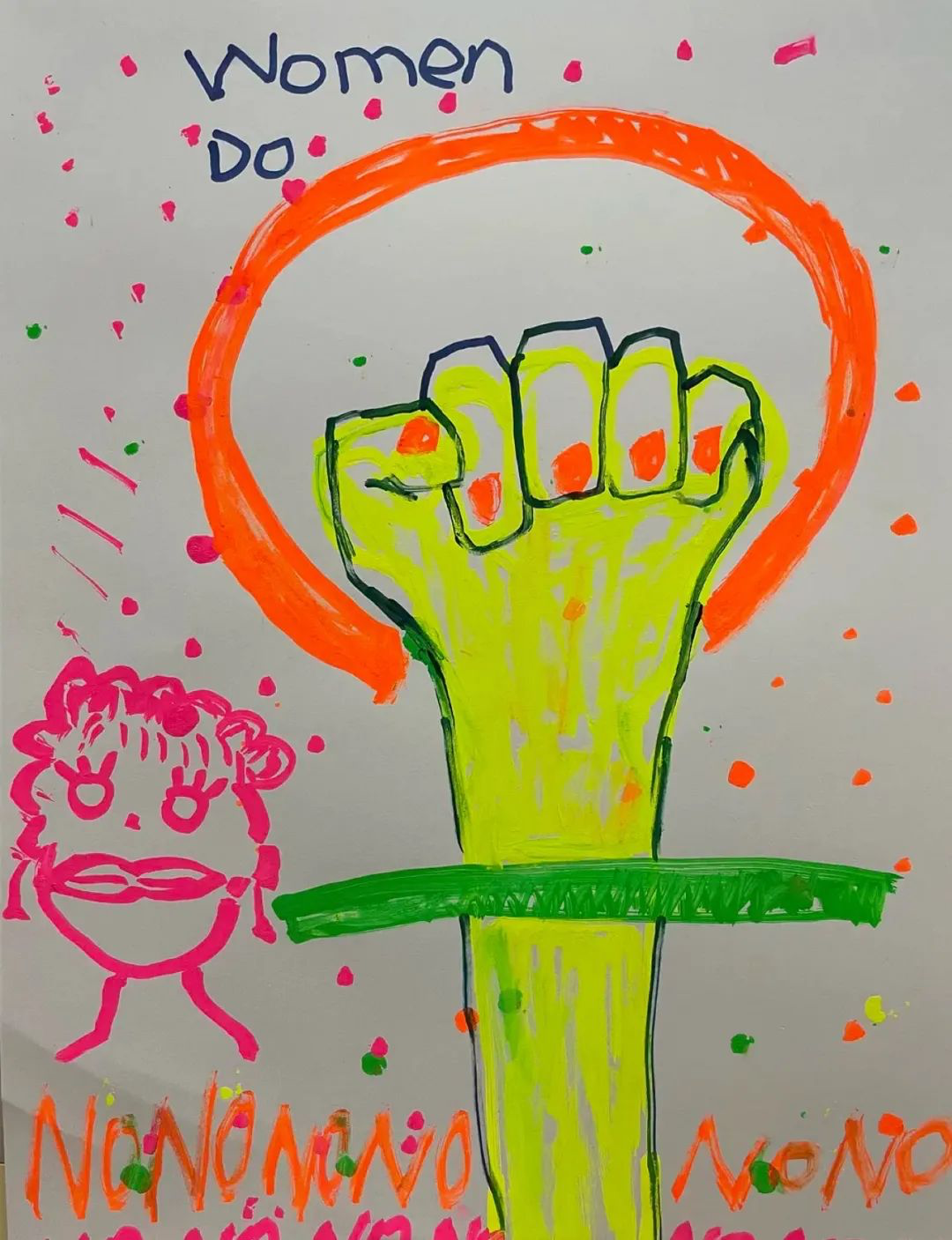 A white poster made with day-glo markers shows crude drawings of a raised fist, a woman’s face, and the English words “Women Do” and “NoNoNoNoNoNo,” at the top and bottom of the poster, respectively. 
