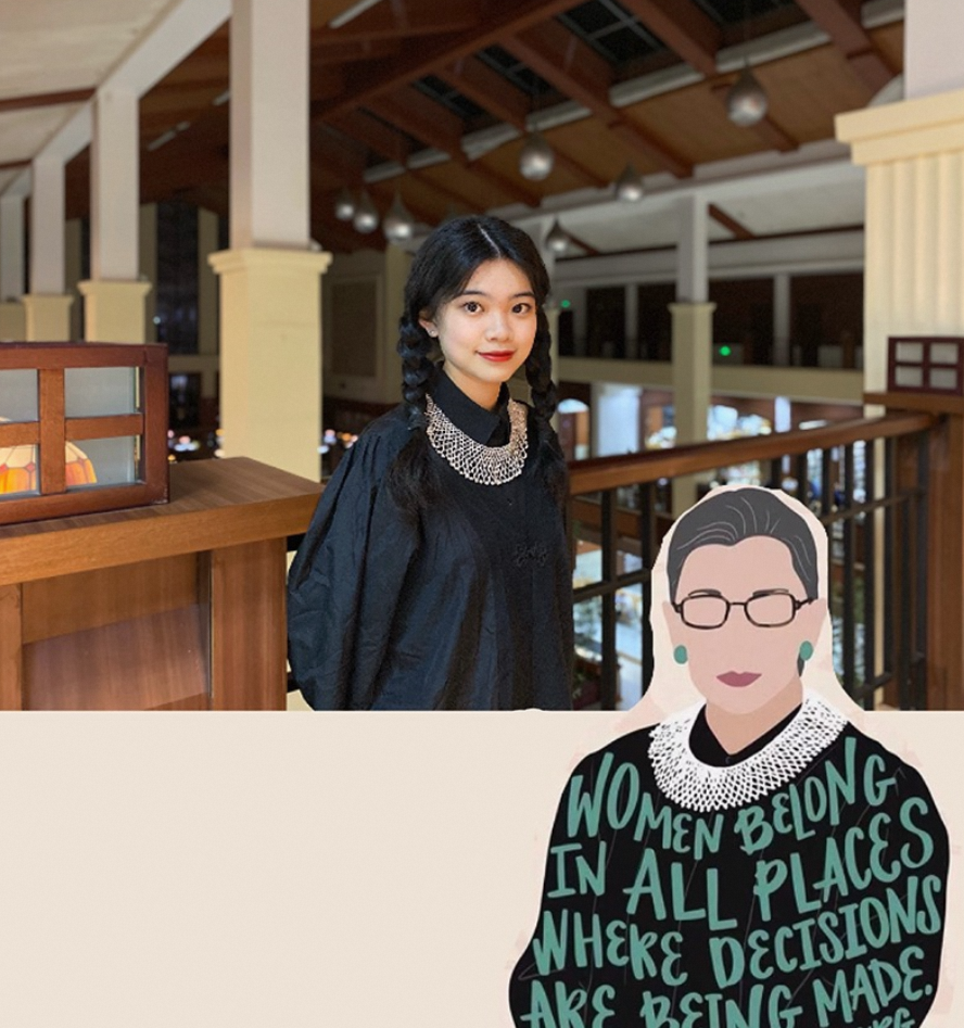 A young woman wearing a black blouse models a necklace resembling one of Ruth Bader Ginsburg’s famed lace collars. At bottom right is a stylized cartoon of RBG wearing a lace collar over her judicial robes, which are emblazoned with a quote from her: “Women belong in all places where decisions are being made.”