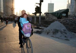 Father brings daughter home from school, Shanghai