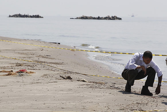 24 Hours in Pictures: President Barack Obama surveys damage along the coastline at Fourchon Beach
