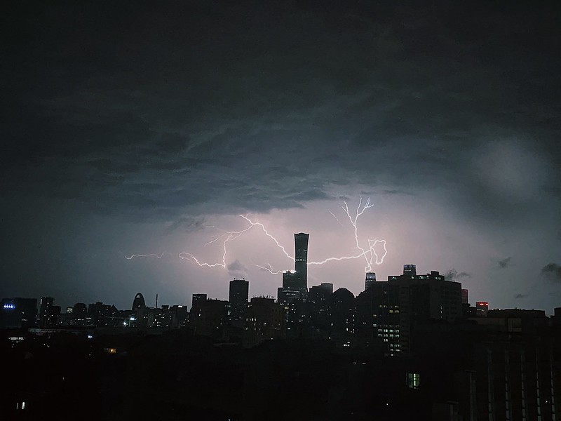Photo: Lightning “passes through” the highest landmark building in Beijing like a dragon, by World Meteorological Organization/Lu Qiao