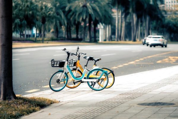A pair of shared bikes by the side of the road
