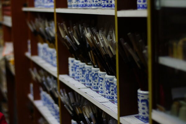 Hundreds of Chinese calligraphy brushes in small blue and white porcelain pots line the narrow shelves of a shop on Dongguan Street in Yangzhou, Jiangsu province.