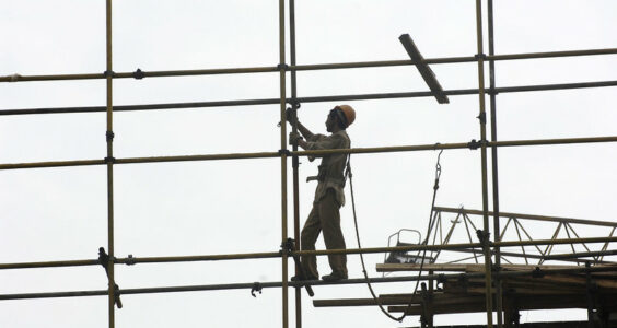 Photo: Workers on a building construction site. City of Beijing. China., by Crozet M./ILO