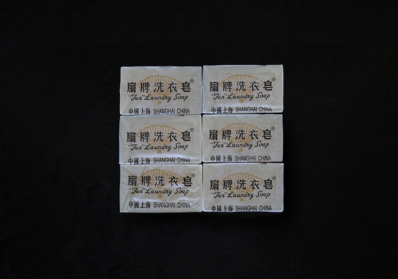Six rectangular bars of "Fan" brand laundry soap, with old-fashioned black, white, and yellow labels showing that the soap is made in Shanghai, China.