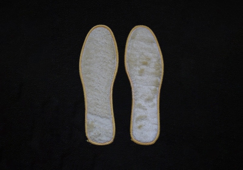 A white pair of padded insoles.