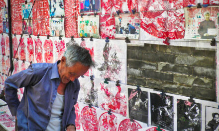 Photo: China, Pingyao – Street vendor of paper cutting art, by Cyprien Hauser