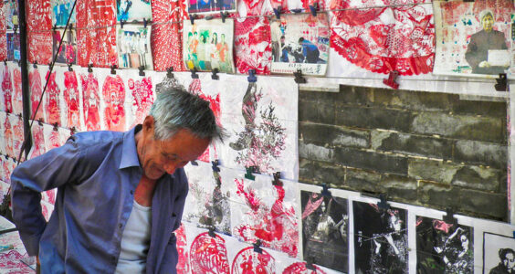 Photo: China, Pingyao – Street vendor of paper cutting art, by Cyprien Hauser